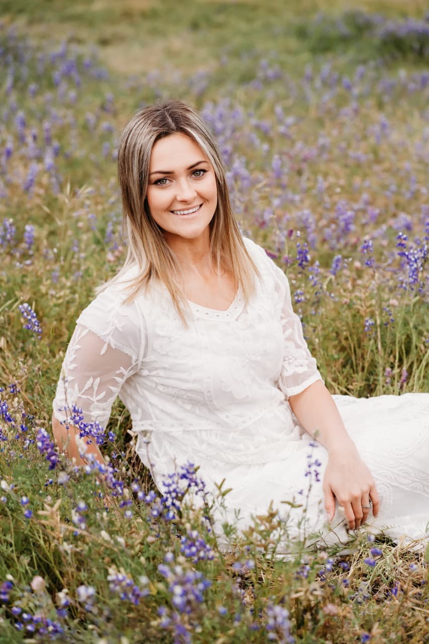 Woman in a lace dress in a meadow